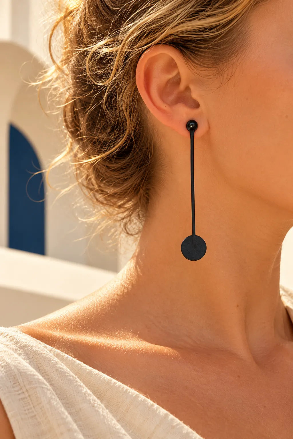 TUN CIRCLE DROP EARRINGS by Tun, worn on a model, cream editorial hero