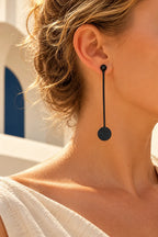 TUN CIRCLE DROP EARRINGS by Tun, worn on a model, cream editorial hero