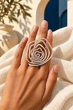 GRAND SPIRAL RING by Monica Krexa, worn on a model, cream editorial hero