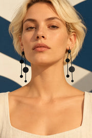 TUN PINA EARRINGS by Tun, worn on a model, cream editorial hero