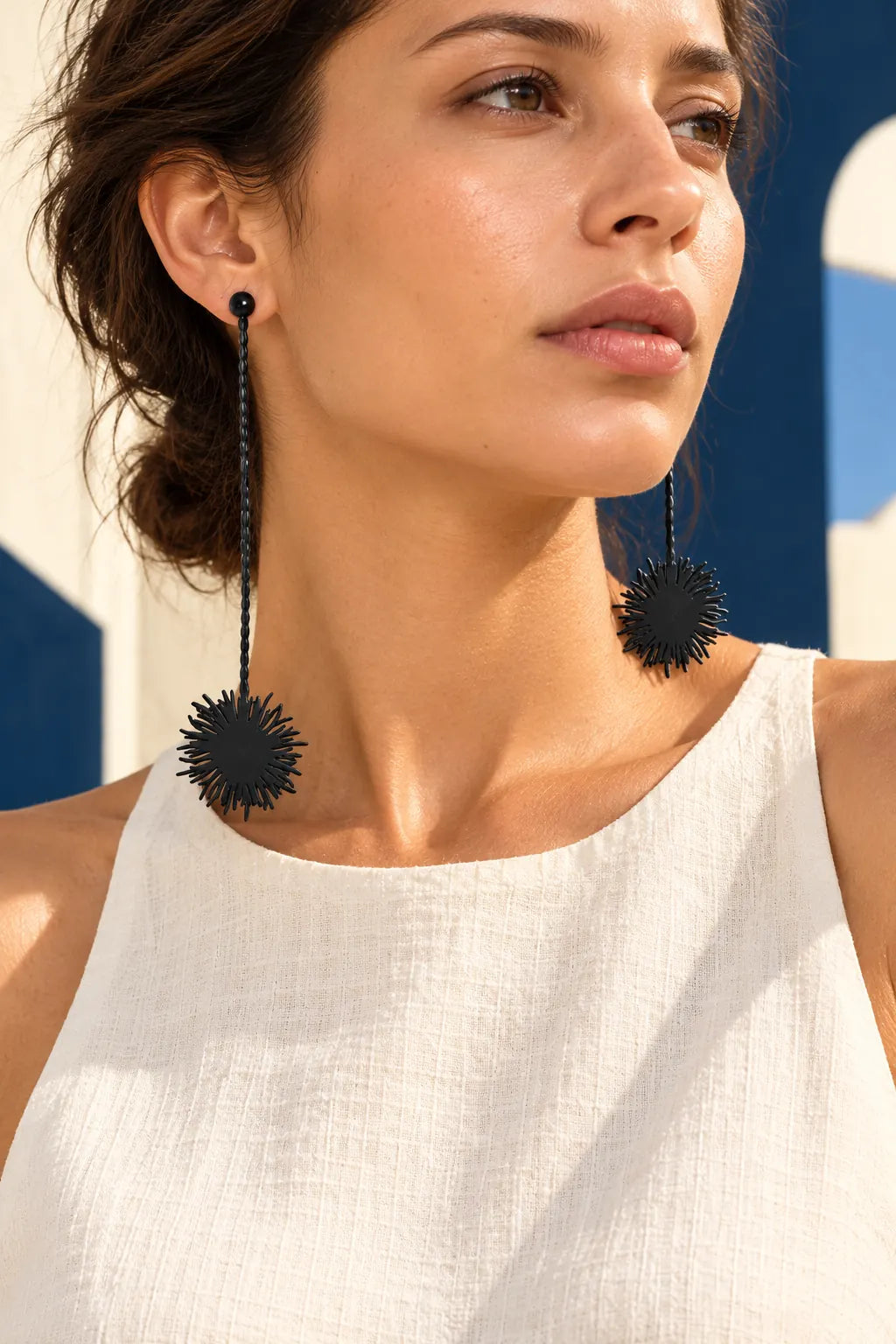 TUN POM POM EARRINGS by Tun, worn on a model, cream editorial hero