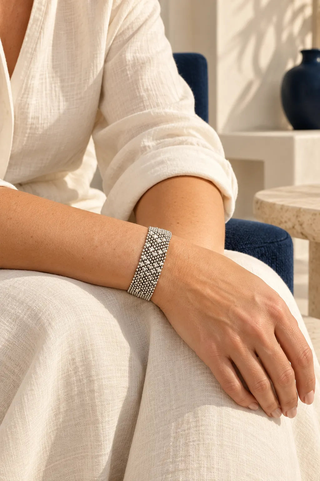 Silver Mesh Amara Bracelet (W 2cm) by Origen Imports by ORIGEN, worn on a model, cream editorial hero
