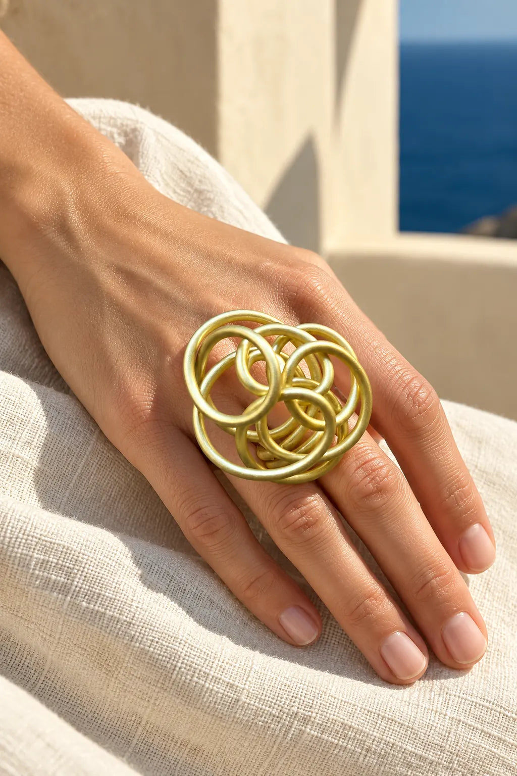 GIANT SCRUNCH RING by Monica Krexa, worn on a model, cream editorial hero