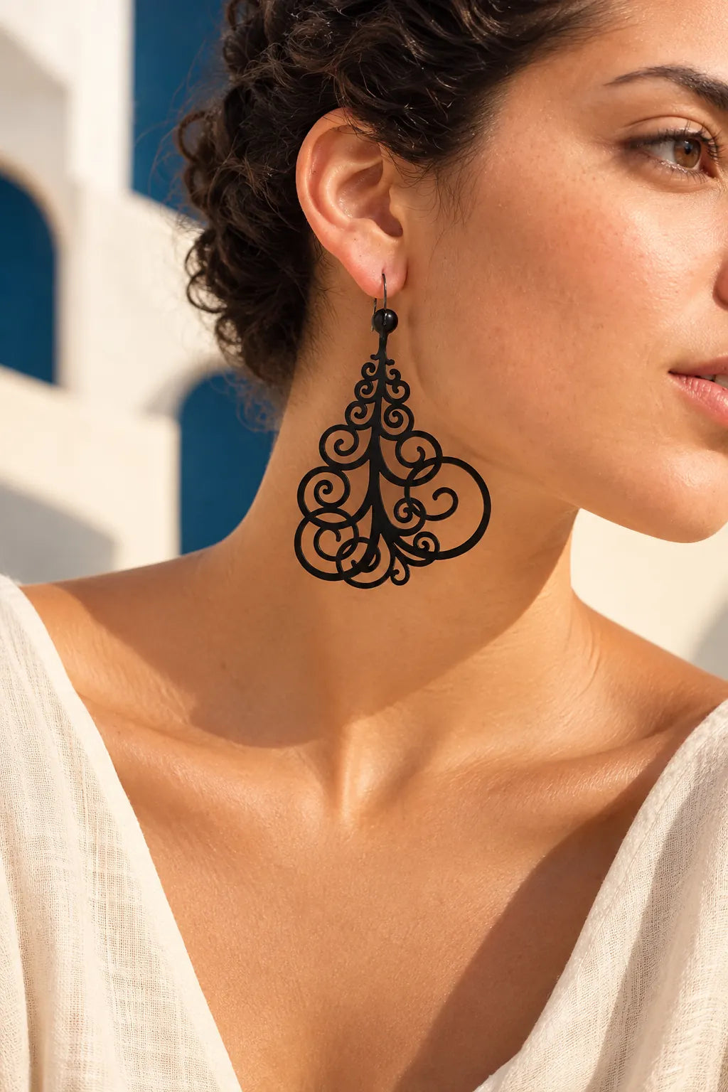 TUN VOLUPIA EARRINGS by Tun, worn on a model, cream editorial hero