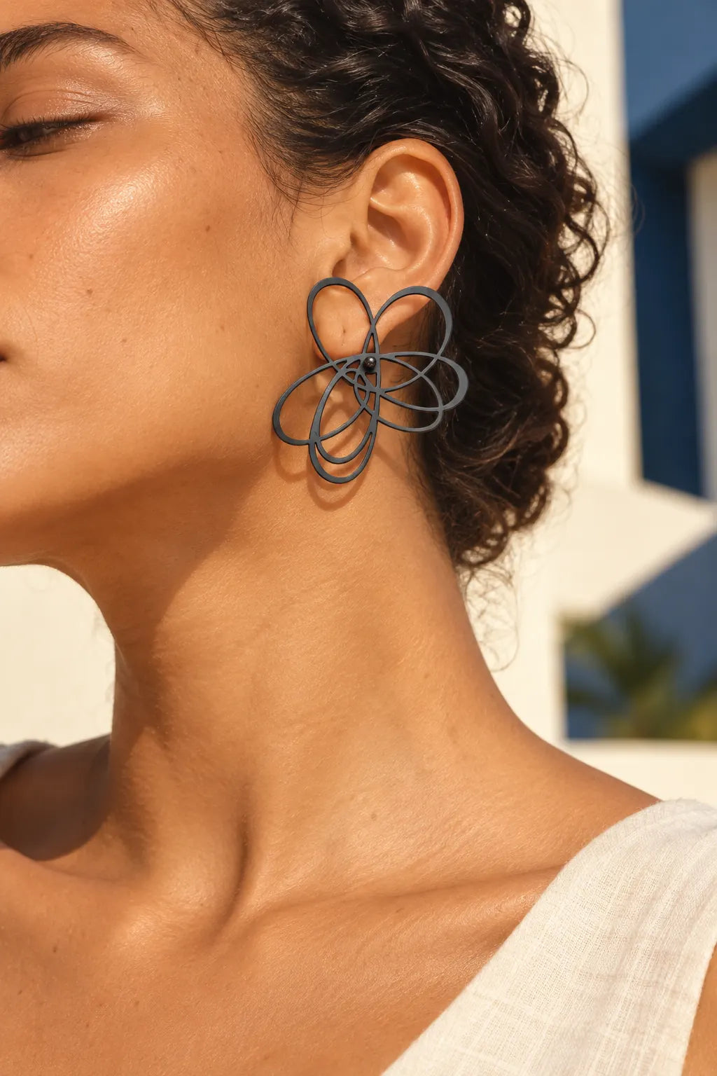 TUN VOLVER EARRINGS by Tun, worn on a model, cream editorial hero